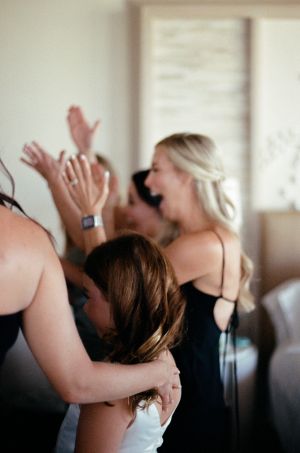 Dress reveal with bridesmaids for wedding in chileno bay auberge resort in los cabos