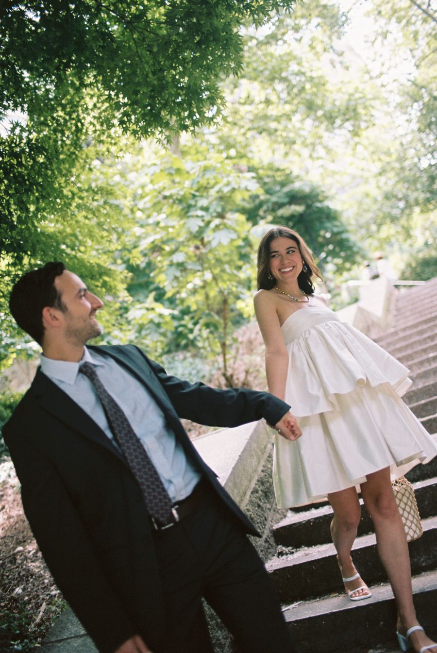 Bride and groom walking in central park in new york city during elopement