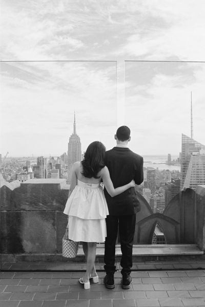 Bride and groom overlooking empire state building during elopement in new york city